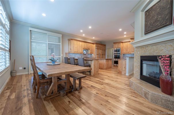 Dining room, Fireplace, Interior, Kitchen, Recessed Lighting, Stainless Steel Appliances, Wood Texture Flooring