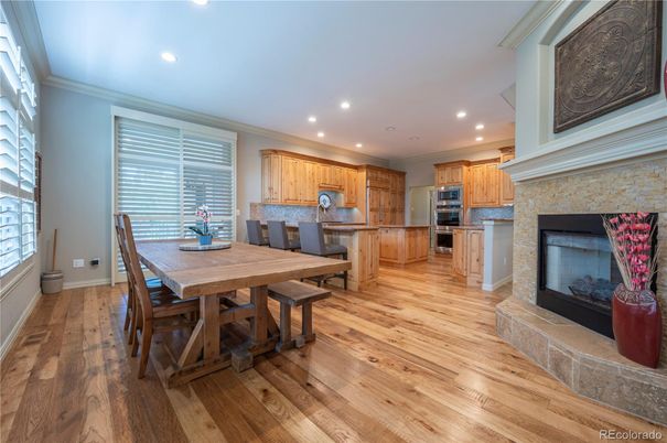 Dining room, Fireplace, Interior, Kitchen, Recessed Lighting, Stainless Steel Appliances, Wood Texture Flooring