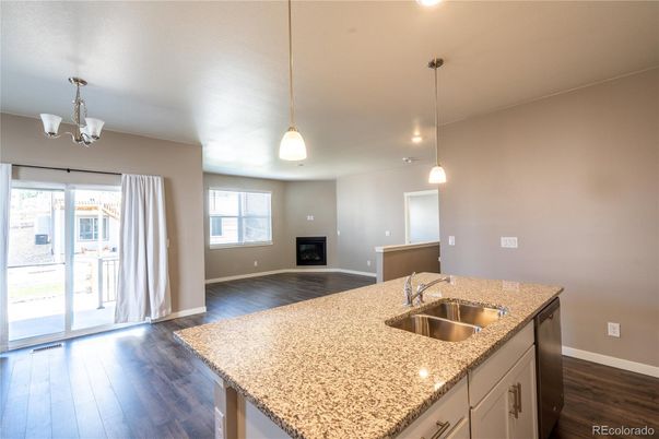 Chandelier, Empty room, Fireplace, Interior, Pendant Lights, Recessed Lighting, Wood Texture Flooring