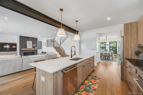 Dining room, Fireplace, Interior, Kitchen, Living room, Pendant Lights, Recessed Lighting, Stainless Steel Appliances, Wood Texture Flooring