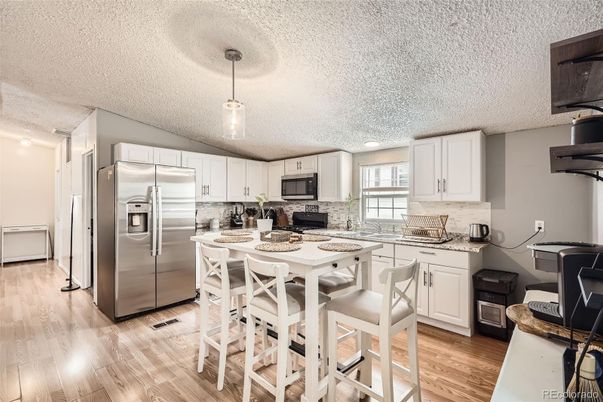 Dining room, Interior, Kitchen, Pendant Lights, Recessed Lighting, Stainless Steel Appliances, Wood Texture Flooring