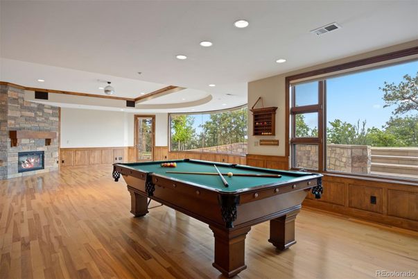 Billiard Table, Fireplace, Game Room, Interior, Recessed Lighting, Stone Walls, Wood Texture Flooring