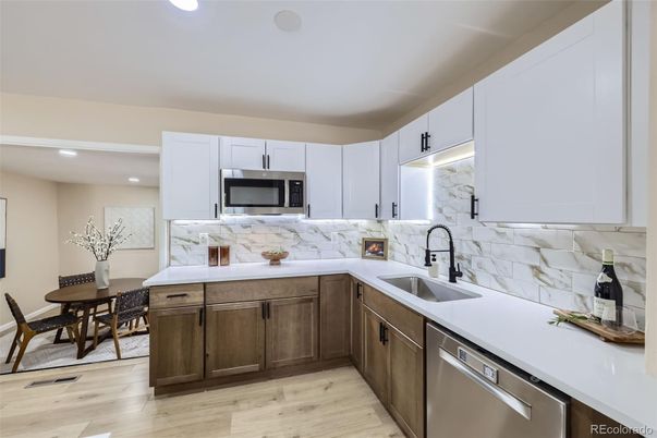 Dining room, Interior, Kitchen, Marble Walls, Recessed Lighting, Stainless Steel Appliances, Wood Texture Flooring