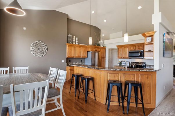 Dining room, Interior, Kitchen, Pendant Lights, Recessed Lighting, Stainless Steel Appliances, Wood Texture Flooring
