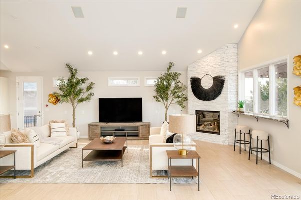 Fireplace, Interior, Living room, Recessed Lighting, Stone Walls, Wood Texture Flooring