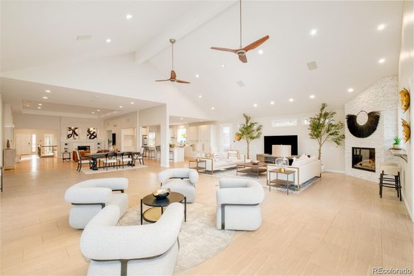 Dining room, Fireplace, Interior, Living room, Recessed Lighting, Stone Walls, Wood Texture Flooring
