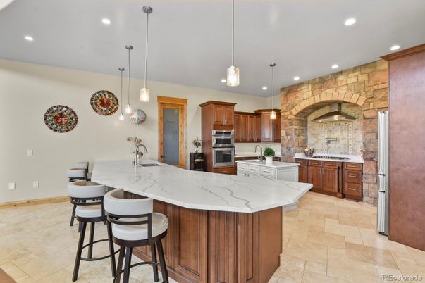 Interior, Kitchen, Pendant Lights, Recessed Lighting, Stainless Steel Appliances, Stone Walls