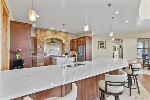 Interior, Kitchen, Pendant Lights, Recessed Lighting, Stainless Steel Appliances, Stone Walls, Wood Texture Flooring