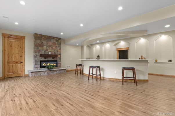 Fireplace, Interior, Recessed Lighting, Stone Walls, Wood Texture Flooring