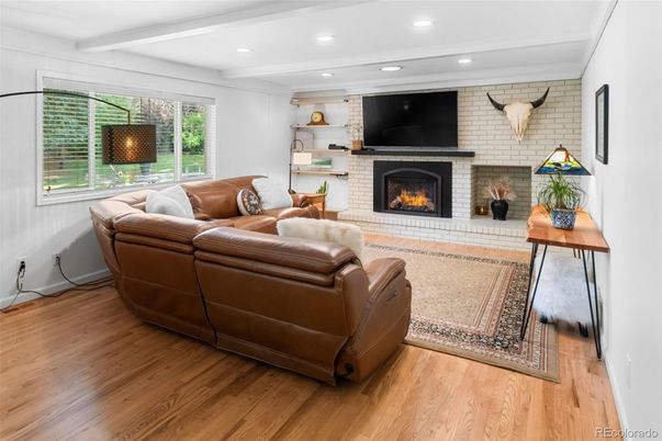 Fireplace, Interior, Living room, Recessed Lighting, Stone Walls, Wood Texture Flooring