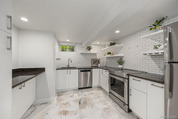 Interior, Kitchen, Marble, Recessed Lighting, Stainless Steel Appliances, Stone Walls