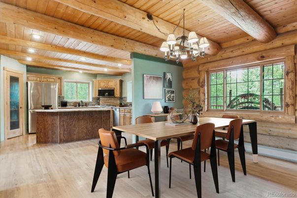 Chandelier, Dining room, Interior, Kitchen, Recessed Lighting, Stainless Steel Appliances, Wooden Beams, Wooden Ceilings, Wood Texture Flooring