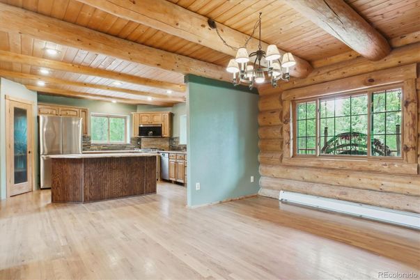 Chandelier, Empty room, Interior, Kitchen, Recessed Lighting, Stainless Steel Appliances, Wooden Beams, Wooden Ceilings, Wood Texture Flooring, Wooden Walls