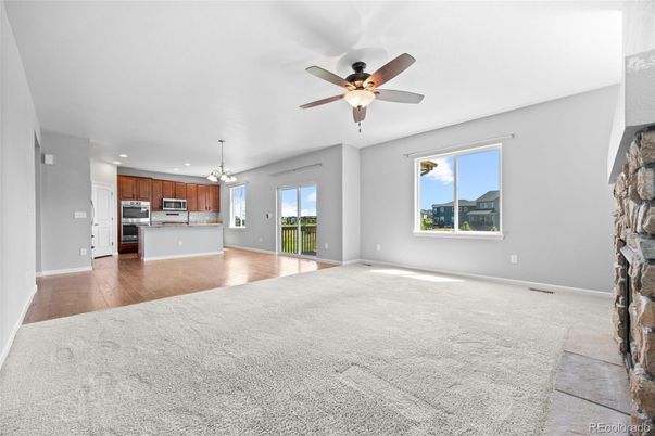 Empty room, Interior, Kitchen, Pendant Lights, Recessed Lighting, Stainless Steel Appliances, Wood Texture Flooring