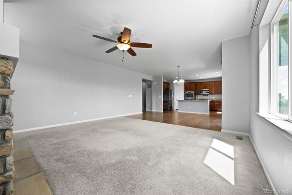 Chandelier, Empty room, Fireplace, Interior, Kitchen, Pendant Lights, Recessed Lighting, Wood Texture Flooring