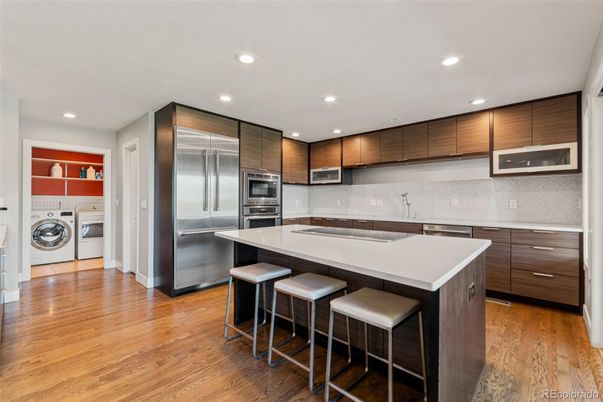 Interior, Kitchen, Recessed Lighting, Stainless Steel Appliances, Washer, Wood Texture Flooring