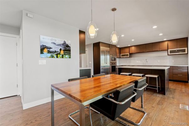 Dining room, Interior, Kitchen, Pendant Lights, Recessed Lighting, Stainless Steel Appliances, Wood Texture Flooring