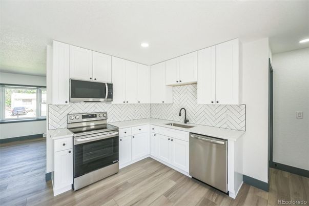 Interior, Kitchen, Recessed Lighting, Stainless Steel Appliances, Wood Texture Flooring