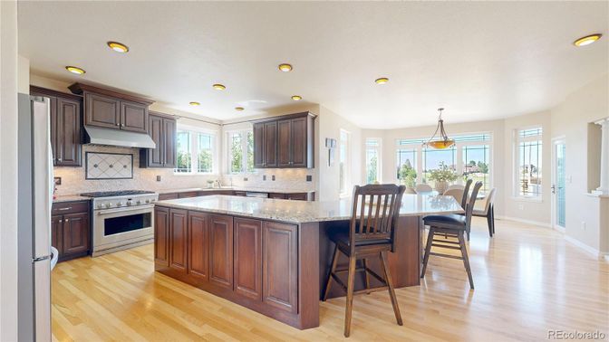 Dining room, Interior, Kitchen, Pendant Lights, Recessed Lighting, Stainless Steel Appliances, Wood Texture Flooring