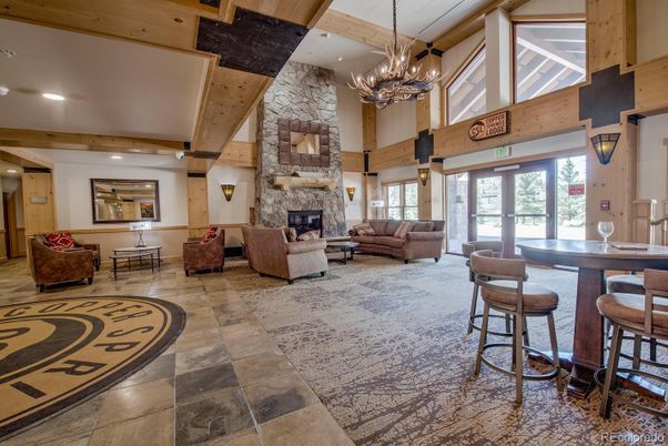 Chandelier, Fireplace, Interior, Living room, Recessed Lighting, Stone Walls, Wooden Beams, Wooden Ceilings