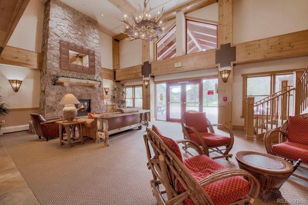 Chandelier, Fireplace, Interior, Living room, Stone Walls, Wooden Beams, Wooden Walls