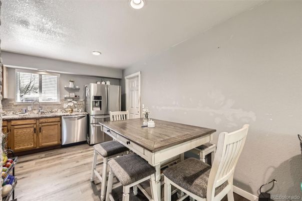 Dining room, Interior, Kitchen, Recessed Lighting, Stainless Steel Appliances, Wood Texture Flooring