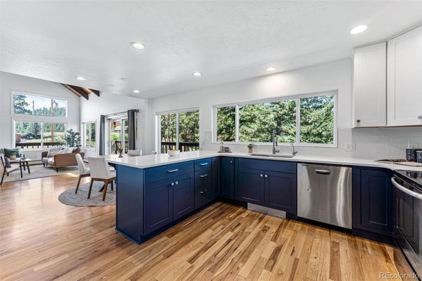 Dining room, Interior, Kitchen, Living room, Recessed Lighting, Stainless Steel Appliances, Wood Texture Flooring