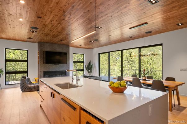 Fireplace, Interior, Kitchen, Pendant Lights, Recessed Lighting, Stone Walls, Wooden Ceilings, Wood Texture Flooring