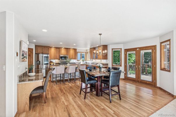 Chandelier, Dining room, Interior, Kitchen, Pendant Lights, Recessed Lighting, Stainless Steel Appliances, Wood Texture Flooring