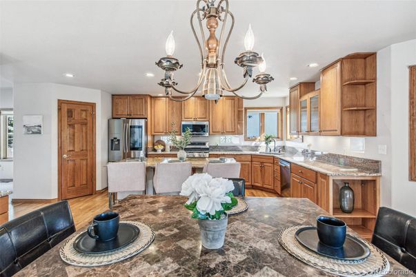 Chandelier, Dining room, Interior, Kitchen, Recessed Lighting, Stainless Steel Appliances, Wood Texture Flooring