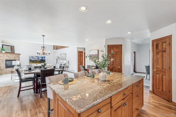 Chandelier, Dining room, Fireplace, Interior, Kitchen, Recessed Lighting, Wood Texture Flooring
