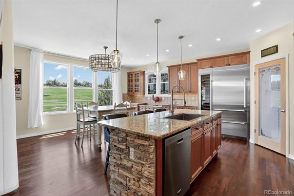 Chandelier, Dining room, Interior, Kitchen, Pendant Lights, Recessed Lighting, Stainless Steel Appliances, Wood Texture Flooring