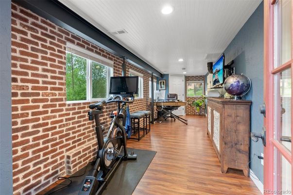 Fitness Equipment, Interior, Recessed Lighting, Stone Walls, Wood Texture Flooring