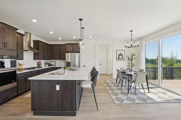 Chandelier, Dining room, Interior, Kitchen, Pendant Lights, Recessed Lighting, Stainless Steel Appliances, Wood Texture Flooring