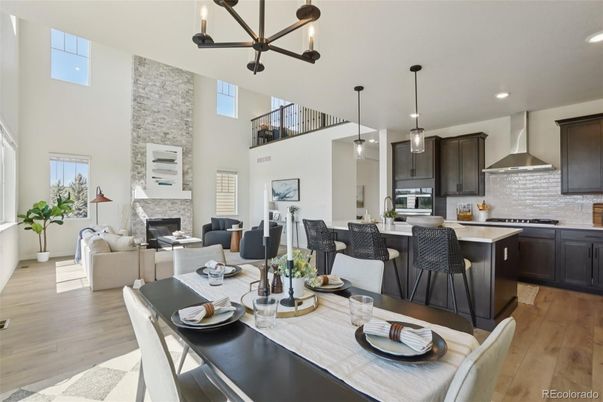 Dining room, Fireplace, Interior, Kitchen, Living room, Pendant Lights, Recessed Lighting, Stainless Steel Appliances, Stone Walls, Wood Texture Flooring
