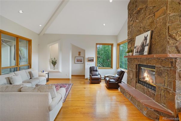 Fireplace, Interior, Living room, Recessed Lighting, Stone Walls, Wood Texture Flooring