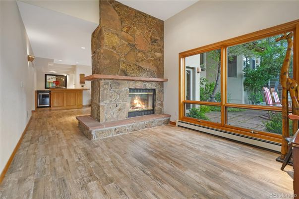 Fireplace, Interior, Recessed Lighting, Stone Walls, Wood Texture Flooring