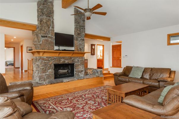 Fireplace, Interior, Living room, Recessed Lighting, Stone Walls, Wooden Beams, Wood Texture Flooring