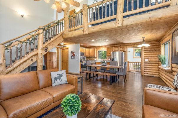 Dining room, Interior, Kitchen, Living room, Pendant Lights, Stainless Steel Appliances, Wood Texture Flooring, Wooden Walls
