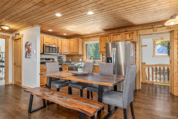 Dining room, Interior, Kitchen, Recessed Lighting, Stainless Steel Appliances, Wooden Ceilings, Wood Texture Flooring