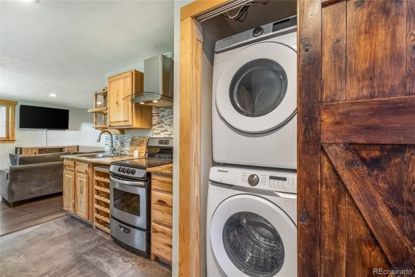 Interior, Kitchen, Recessed Lighting, Washer, Wood Texture Flooring