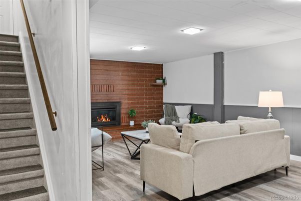 Fireplace, Interior, Living room, Recessed Lighting, Stone Walls, Wood Texture Flooring, Wooden Walls