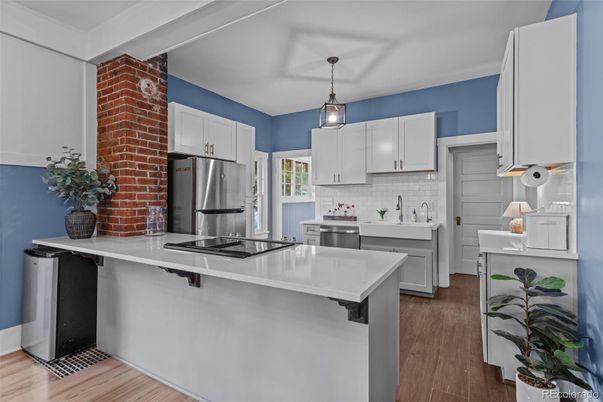 Interior, Kitchen, Pendant Lights, Stainless Steel Appliances, Stone Walls, Wood Texture Flooring