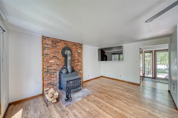 Empty room, Fireplace, Interior, Stone Walls, Wood Texture Flooring