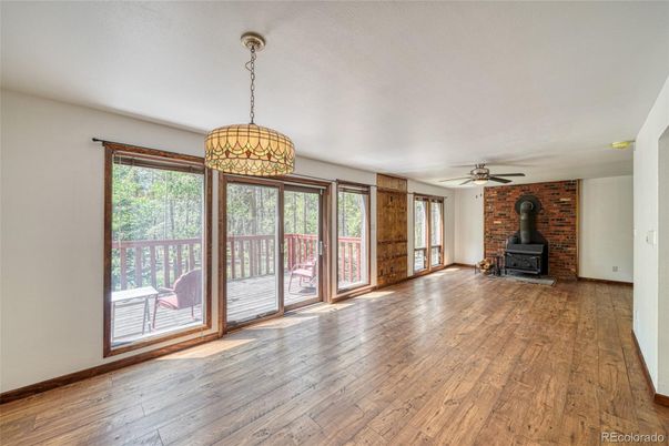 Empty room, Fireplace, Interior, Pendant Lights, Stone Walls, Wood Texture Flooring