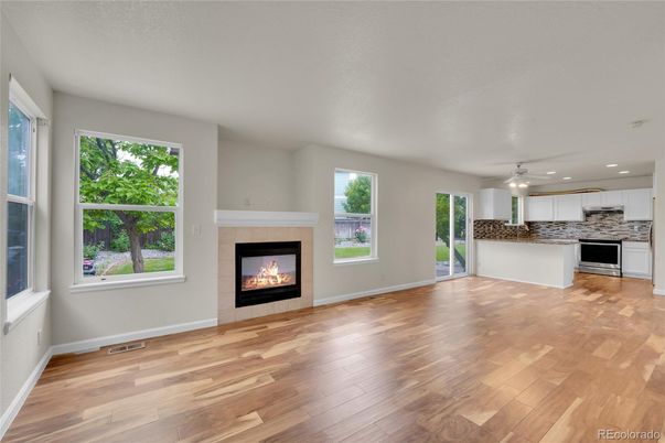 Empty room, Fireplace, Interior, Kitchen, Recessed Lighting, Wood Texture Flooring