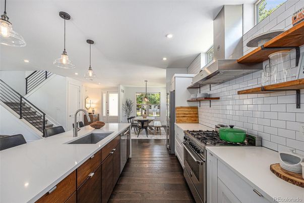 Dining room, Interior, Kitchen, Pendant Lights, Recessed Lighting, Stainless Steel Appliances, Wood Texture Flooring