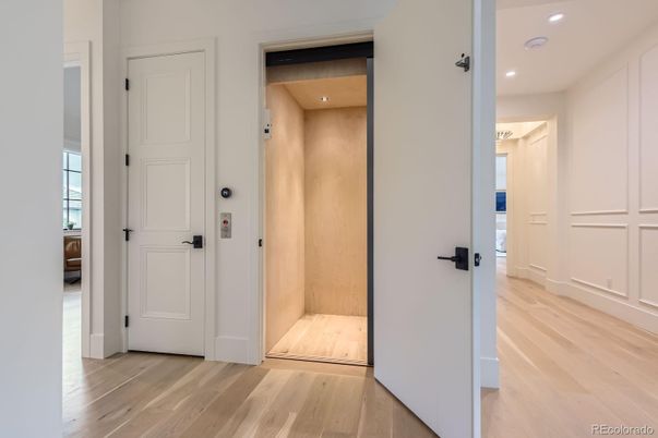 Elevator, Interior, Recessed Lighting, Wood Texture Flooring, Wooden Walls