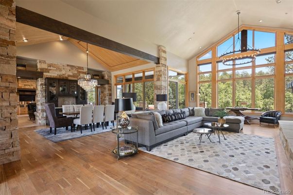 Chandelier, Dining room, Fireplace, Interior, Living room, Recessed Lighting, Stone Walls, Wooden Beams, Wooden Ceilings, Wood Texture Flooring