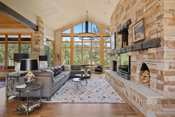 Fireplace, Interior, Living room, Recessed Lighting, Stone Walls, Wood Texture Flooring